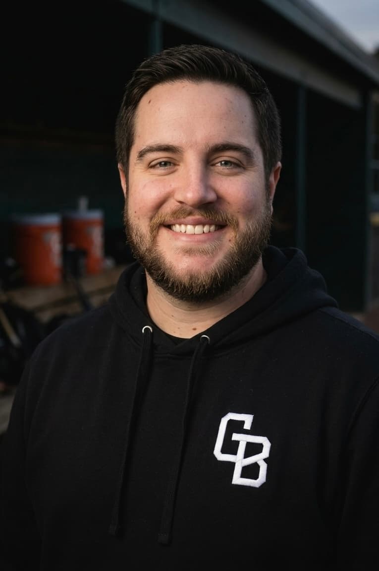 Coach Andy Layman — headshot in the dugout